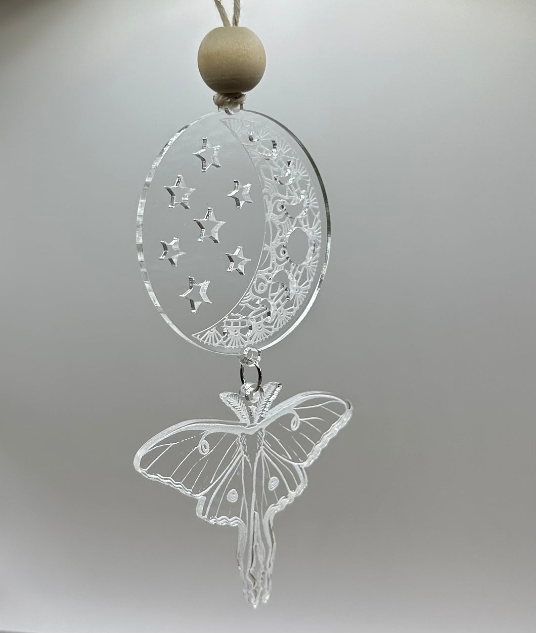 Moon and moth ornament